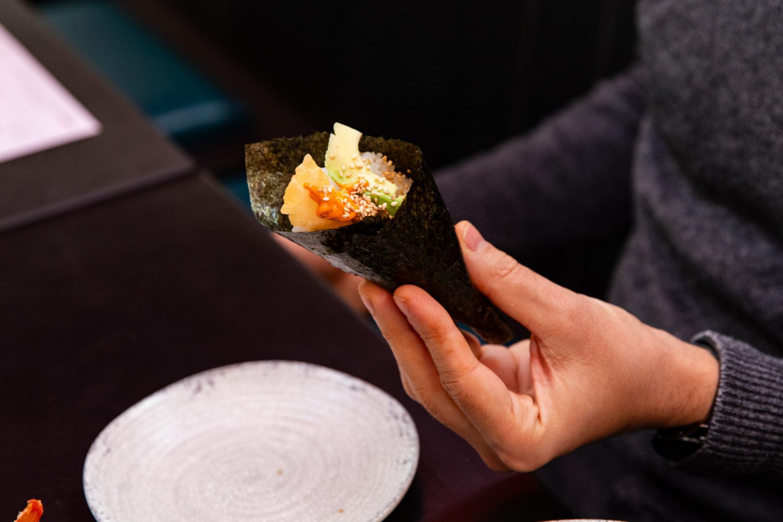 hands-rolling-sushi-maki